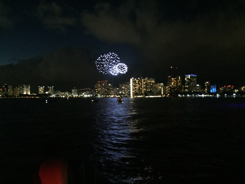 waikiki fireworks show seen from a boat cruise with living ocean tours